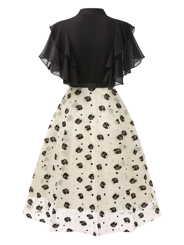 Robe trapèze noire à volants roses dorées col montant années 1950