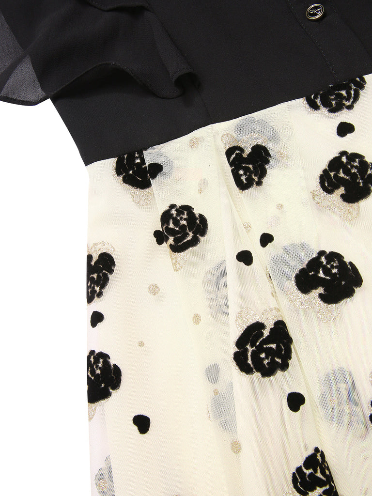Robe trapèze noire à volants roses dorées col montant années 1950