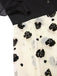 Robe trapèze noire à volants roses dorées col montant années 1950