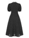 Robe noire à pois et col noué des années 40