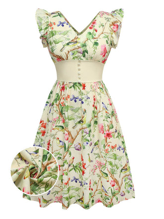 Robe jaune oiseaux et fleurs à volants années 1950