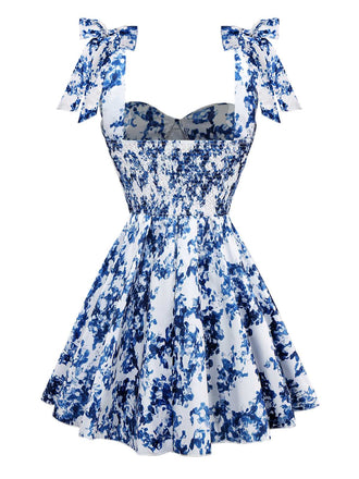 Robe patineuse bleue à fleurs et épaules nouées années 1960
