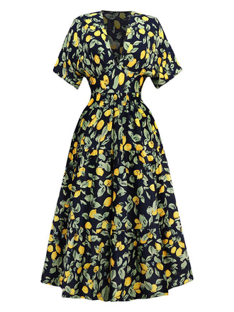 Robe en mousseline de soie jaune citron col V et smocks des années 1950