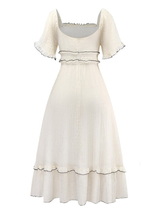 Robe abricot à col carré et bordure texturée années 1930