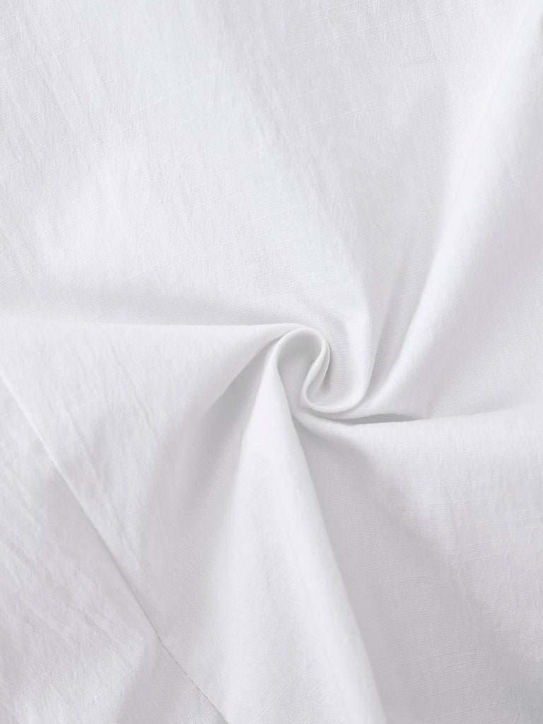 Chemisier blanche à manches bouffantes et nœud années 1960