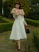 Manteau à col en fourrure multicouche crème années 1950