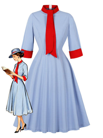 Robe bleue col montant et nœud contrastant années 1950