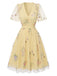 Robe verte manches bouffantes et broderies florales en résille années 50