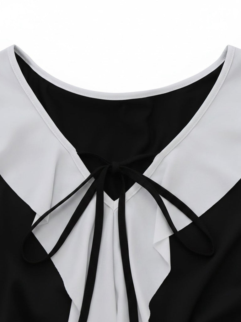 Robe péplum à volants noire et blanche années 1960