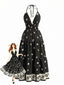 Maxi-robe bohème noire dos nu et col halter années 70