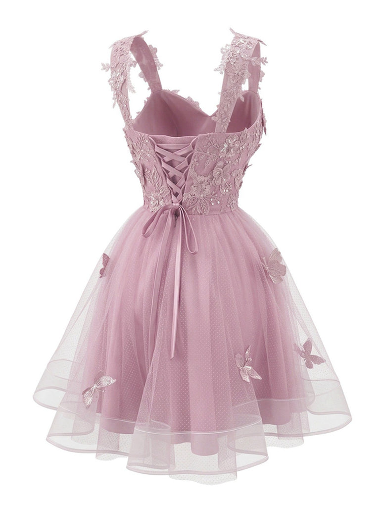 Robe courte rose à paillettes et papillons années 60