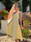 Robe jaune fines bretelles et imprimé floral jacquard années 1950