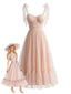 Robe rose foncé pois suisses et manches bouffantes années 1950