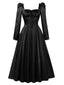 Robe noire à col carré manches bouffantes et corset années 1940