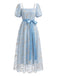 Robe longue à fleurs brodées, nœud et manches bouffantes années 1970