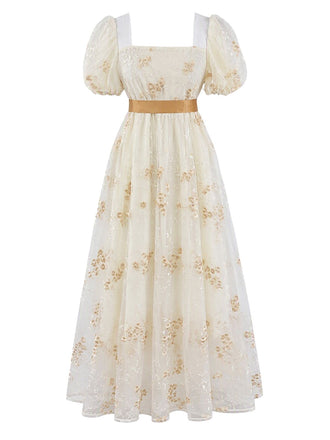 Robe longue à fleurs brodées, nœud et manches bouffantes années 1970