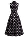 Robe à pois sans manches, revers, nœud et ceinture Années 1950
