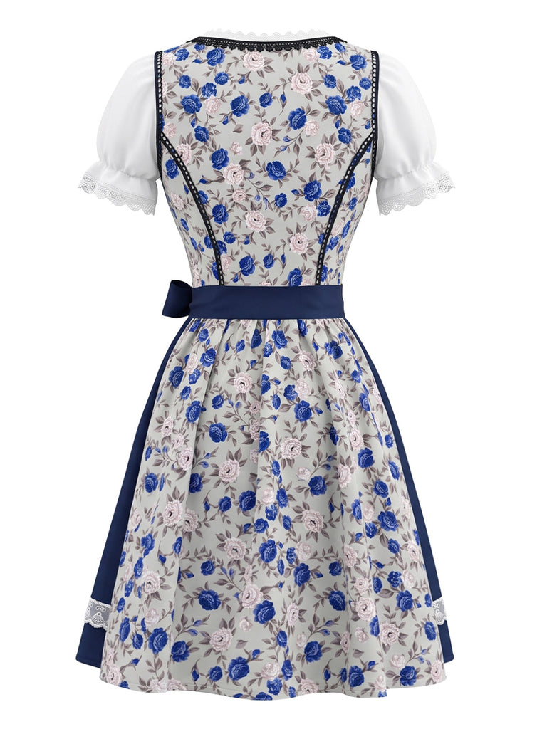 Robe bleue et blanche à fleurs, dentelle et manches bouffantes avec tablier années 1950