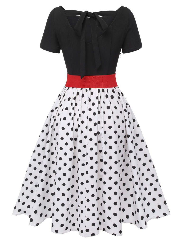 Robe noire à pois et col bateau des années 50