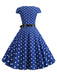 Robe ceinturée à pois et manches capes des années 1950