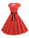 Robe ceinturée à pois et manches capes des années 1950
