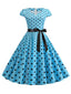 Robe ceinturée à pois et manches capes des années 1950