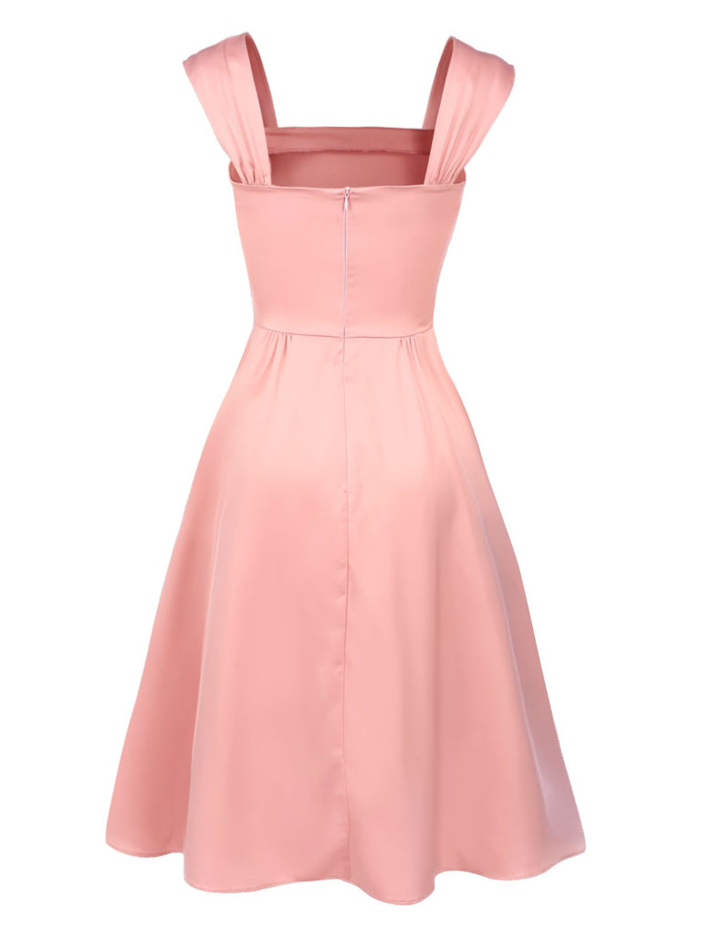 Robe rose clair unie à col carré et nœud des années 40