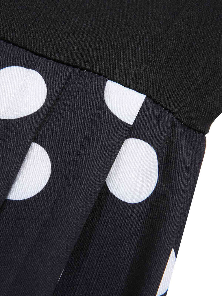 Robe noire à pois patchwork des années 40 avec ceinture nouée