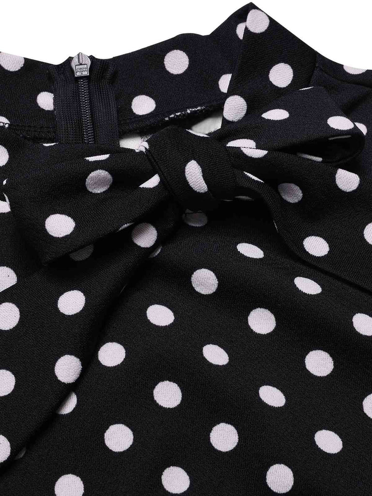 Robe noire à pois et col noué des années 1960