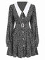 Robe noire à manches lanternes  à petites fleurs revers des années 1950