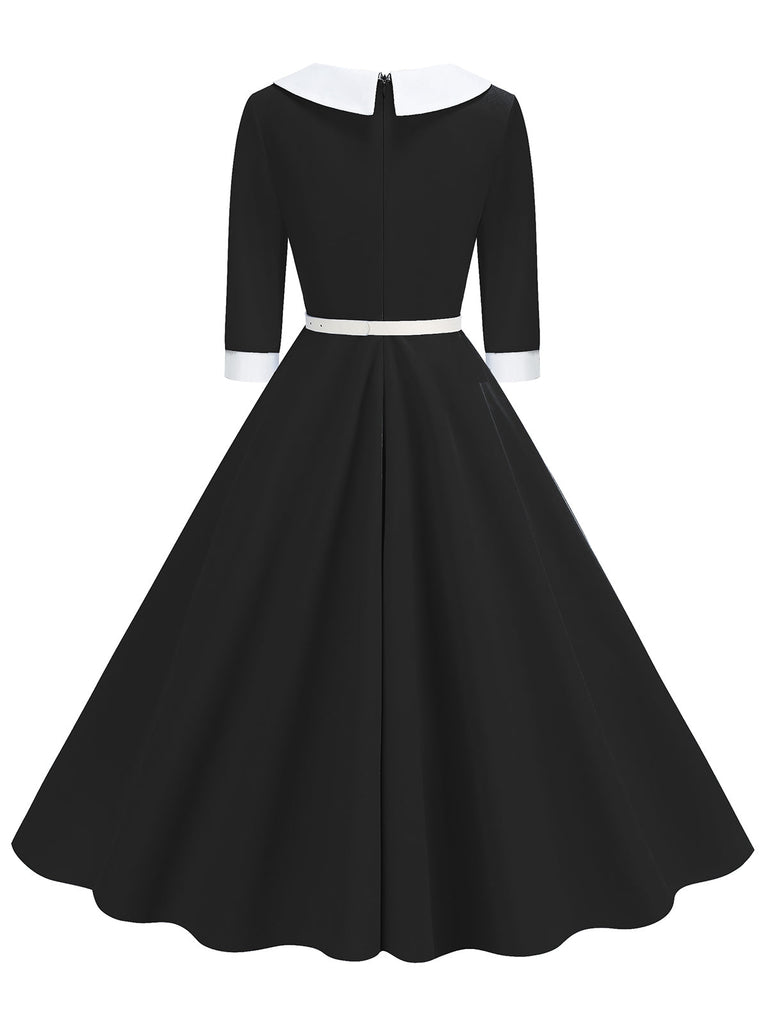 Robe à revers ceinturée et à col contrasté des années 1950