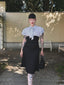 Robe sirène noire à pois et col noué des années 1930