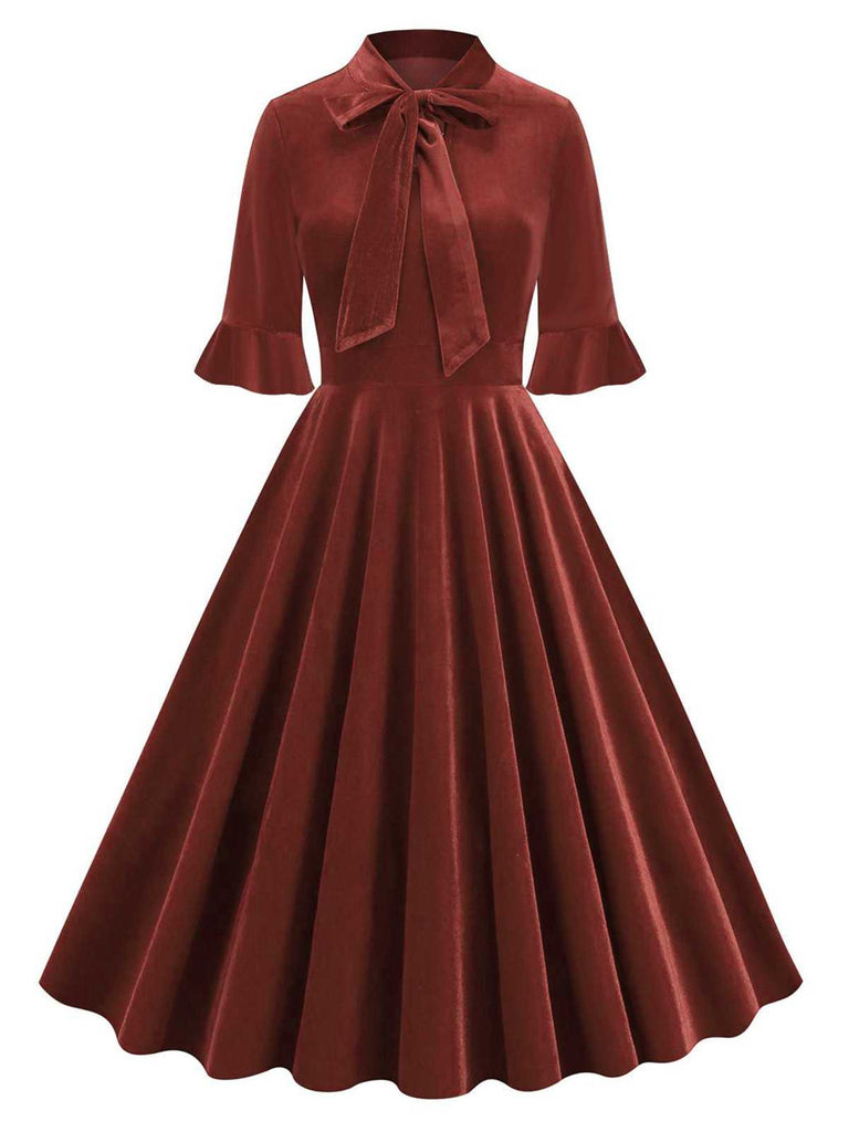 Robe à manches évasées en velours avec col noué des années 1950