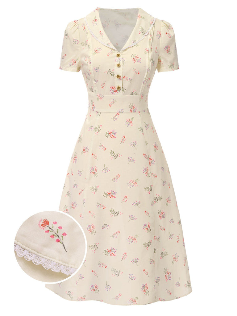 Robe bleu à manches bouffantes et revers fleuris des années 1940