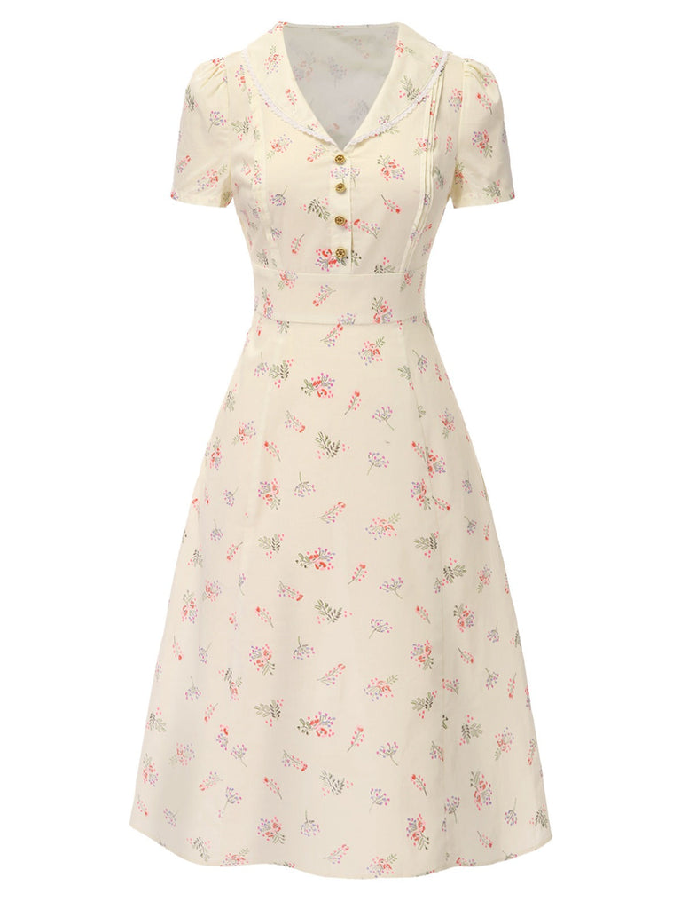 Robe bleu à manches bouffantes et revers fleuris des années 1940