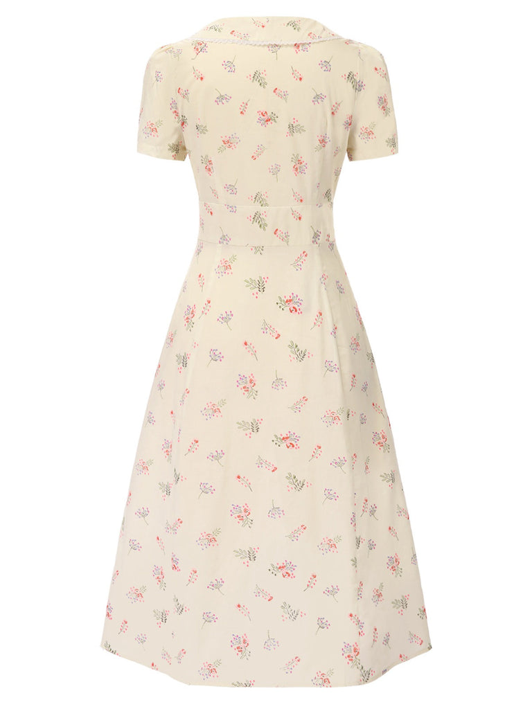 Robe bleu à manches bouffantes et revers fleuris des années 1940