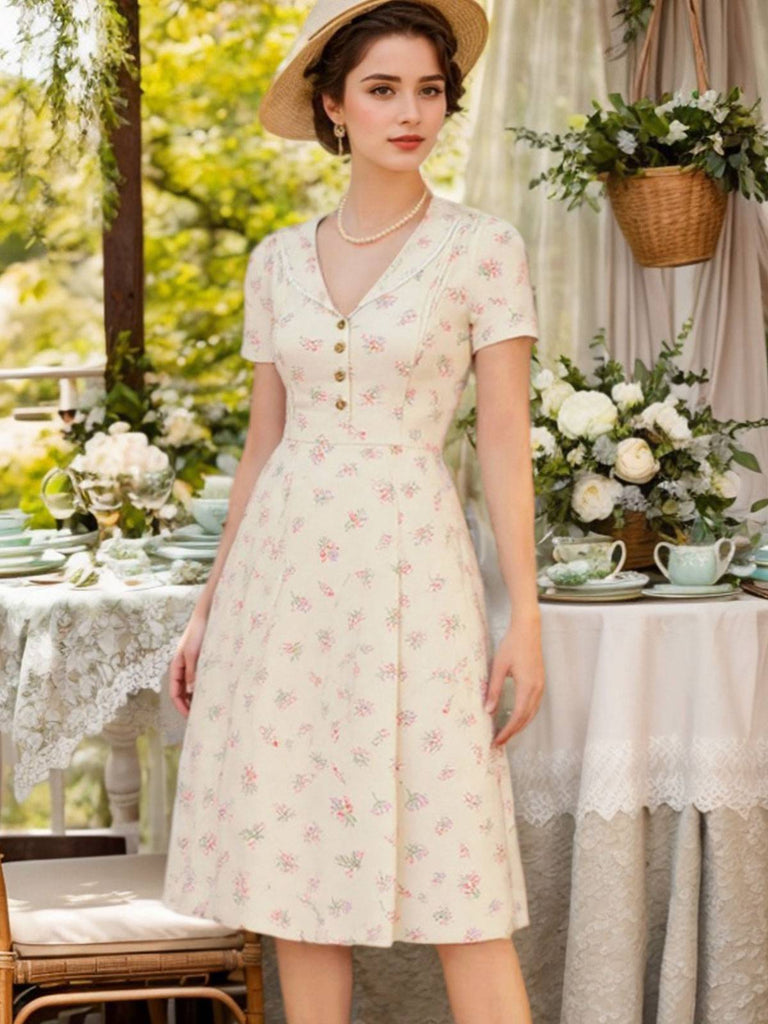 Robe bleu à manches bouffantes et revers fleuris des années 1940
