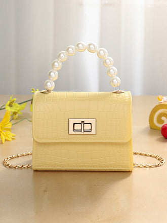 Sac à main à rabat en cuir texturé crocodile vert