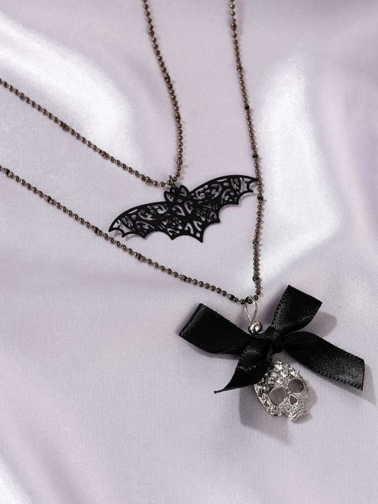 Collier double couche squelette de chauve-souris avec nœud gothique