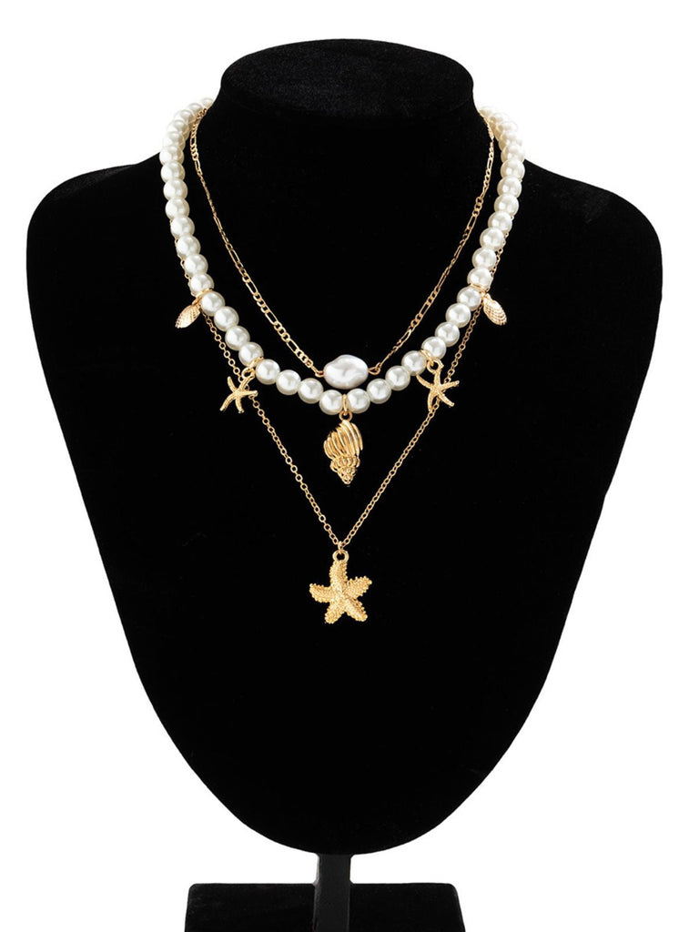 Collier chaîne superposée en perles coquillages et étoiles de mer