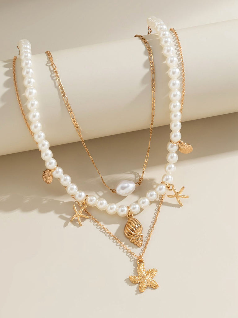 Collier chaîne superposée en perles coquillages et étoiles de mer