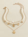 Collier chaîne superposée en perles coquillages et étoiles de mer
