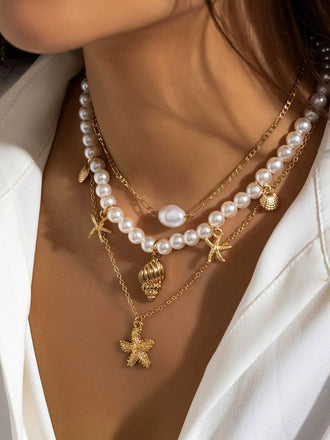 Collier chaîne superposée en perles coquillages et étoiles de mer