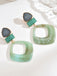 Boucles d'oreilles vintage en résine marbrée à motif géométrique exagéré