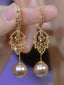 Boucles d'oreilles pendantes dorées feuille en strass et perle