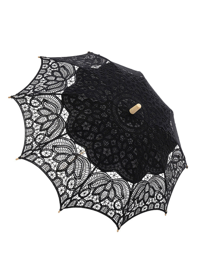 Parapluie vert ajouré en dentelle florale