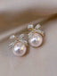 Boucles d'oreilles tige forme nœud perle d'imitation blanche et strass