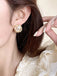 Boucles d'oreilles vintage en alliage d'or et perles
