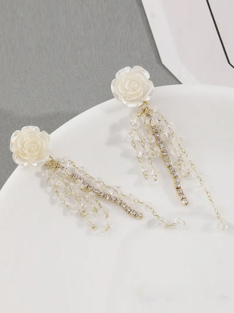 Boucles d'oreilles à pampilles en strass et rose blanche