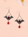 Boucles d'oreilles pendantes en rubis avec motif chauve-souris d'Halloween